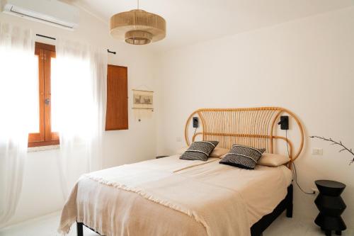 Ένα ή περισσότερα κρεβάτια σε δωμάτιο στο CASA FUILE by casa-orosei