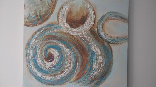 a painting of a vase on a wall at Hostal Boutique Bajamar in Nerja