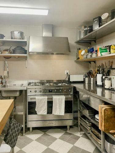a kitchen with a stainless steel stove top oven at Active Holiday In Dalarnas Gopshus in Blyberg