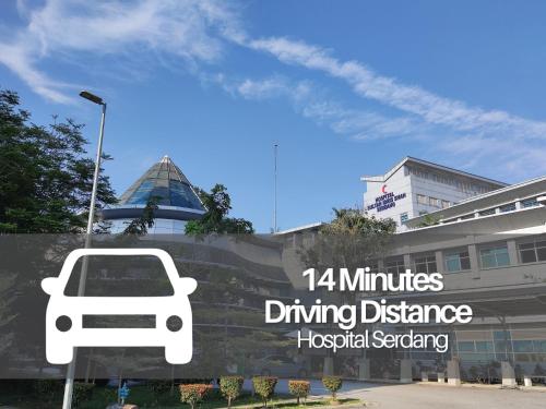 a sign in front of a building with a car on it at Smile Hotel The Mines Seri Kembangan in Serdang