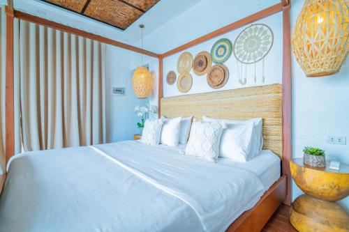 Ένα ή περισσότερα κρεβάτια σε δωμάτιο στο Pearl Bay Villas Private Resort