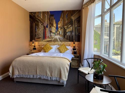 a bedroom with a bed and a wall mural at The Crescent York in York