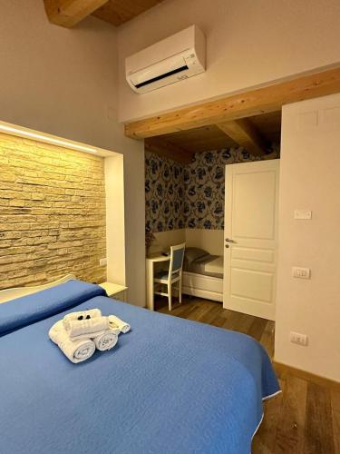 Ένα ή περισσότερα κρεβάτια σε δωμάτιο στο Suite Aura Marina