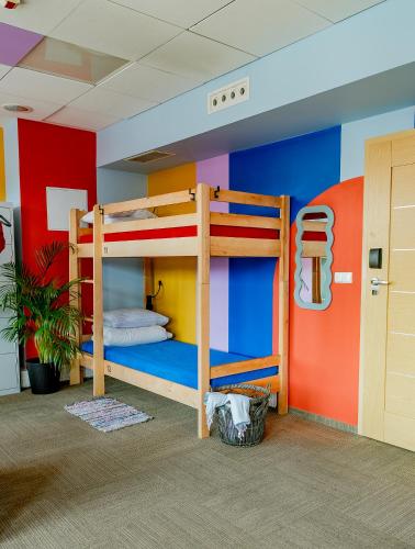 a room with two bunk beds in a room at Hostel Gdańsk Szafarnia 10 Old Town in Gdańsk