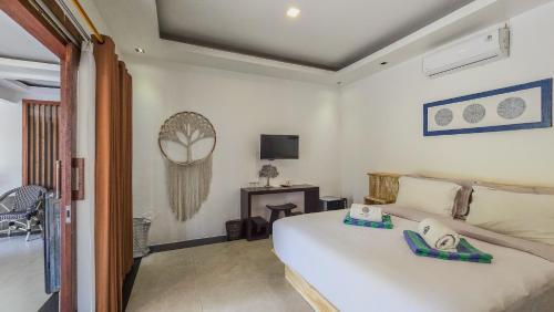 Postel nebo postele na pokoji v ubytování Kies Villas Lombok