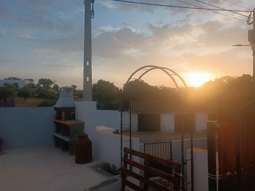 a sunset on the roof of a building at Casa Pito in Santo António do Baldio