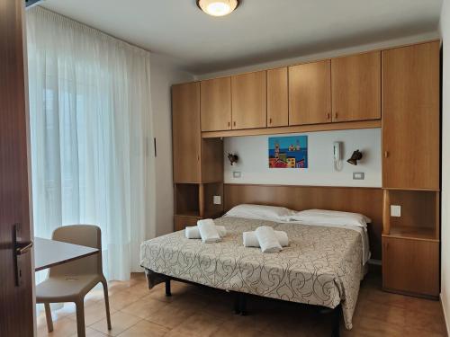 Postel nebo postele na pokoji v ubytování Hotel Anna
