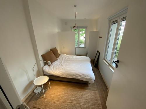 Ένα ή περισσότερα κρεβάτια σε δωμάτιο στο Champagne Apartment, 4P, Parc de la Boverie