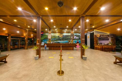 a large building with a room with plants in it at Mafiya Resort in Koh Rong Island