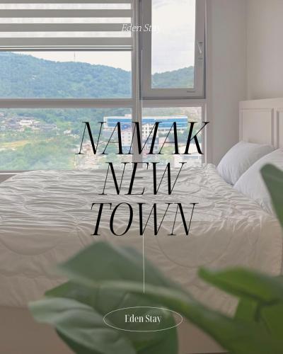 Postel nebo postele na pokoji v ubytování Namak Stay