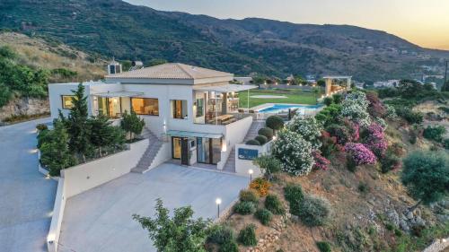 an aerial view of a house at Villa Kedria with a panoramic ocean view in Souda