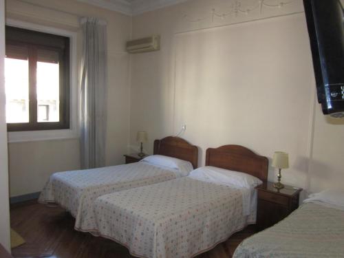 Katil atau katil-katil dalam bilik di Hostal Splendid - Gran Vía