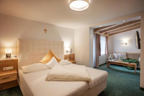 Postel nebo postele na pokoji v ubytování Hotel Garberwirt