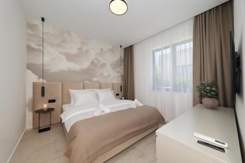 a bedroom with a large bed and a window at Cloud 9 D6 in Tkon