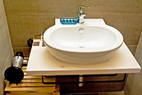 a white sink sitting on a counter in a bathroom at Residence San Martino in Erice