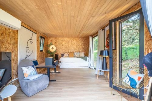 a tiny house with a wooden ceiling at Villa Basoa - Villa avec piscine à 10 min plages in Bassussarry
