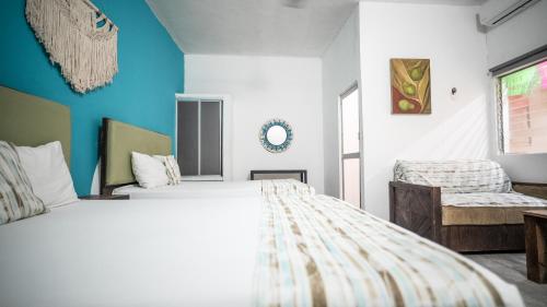 Un ou plusieurs lits dans un hébergement de l'établissement Hotel Posada Aurora