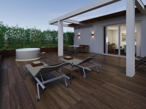 a rendering of a patio with chairs and a table at Gallia Palace Hotel - Relais & Châteaux in Punta Ala