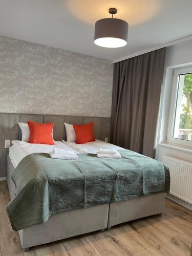 Katil atau katil-katil dalam bilik di Apartamenty Riverside Lębork