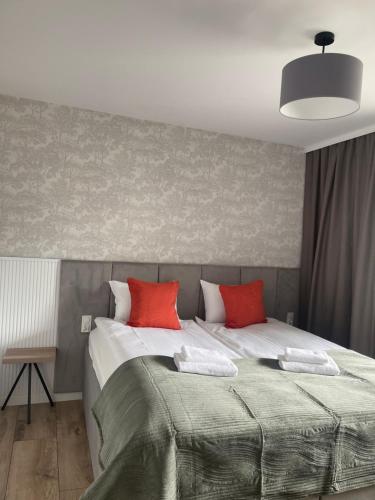 Ένα ή περισσότερα κρεβάτια σε δωμάτιο στο Apartamenty Riverside Lębork