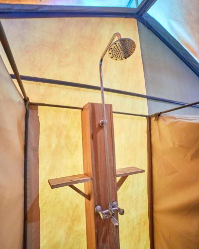 a door in a yurt with a light on it at Migration UnderCanvas in Serengeti