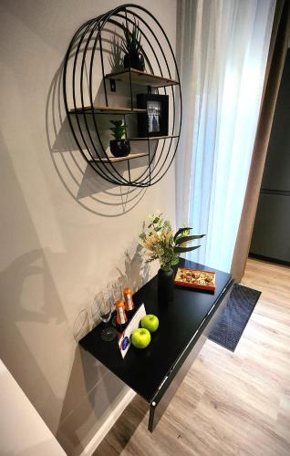 a black table with fruit on it in a room at Neueröffnung Liro Hotel Mönchengladbach in Mönchengladbach