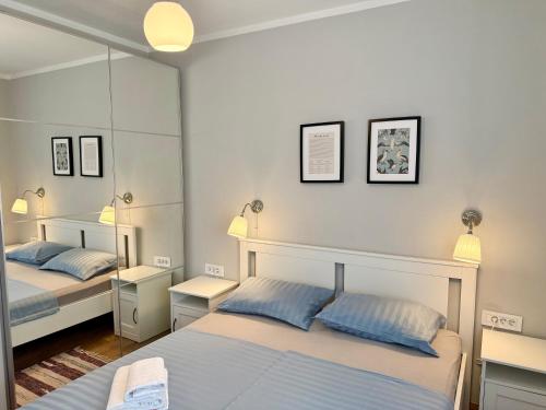 Posteľ alebo postele v izbe v ubytovaní M Plus Residence