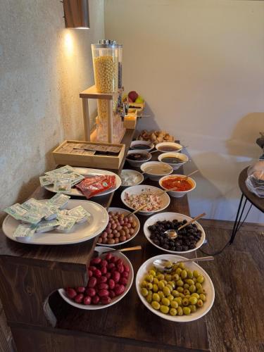 a buffet of different types of food on a table at Flavia Cappadocia Hotel in Uçhisar
