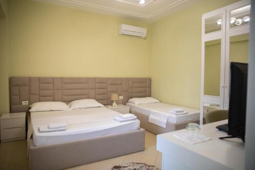 Postel nebo postele na pokoji v ubytování Hotel Merkaj