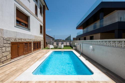 a swimming pool in the backyard of a house at Villa Montalvo Beach in Montalvo