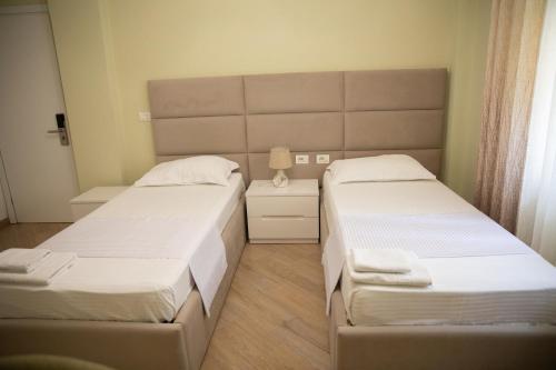 Postel nebo postele na pokoji v ubytování Hotel Merkaj