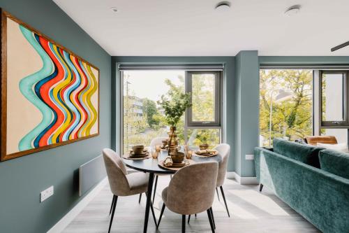 a dining room with a table and chairs at Charles Hope Birmingham Westside in Birmingham
