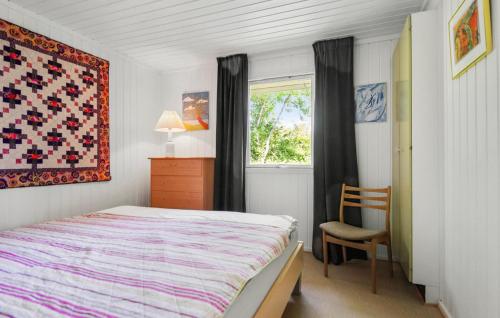 a bedroom with a bed and a window at 3 Bedroom Nice Home In Odder in Beder