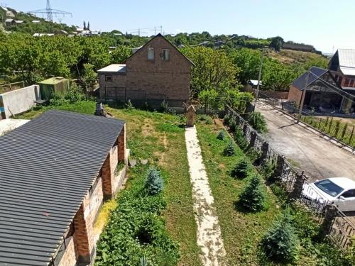 an overhead view of a house with a row of plants at Загородный дом in Nurrnus