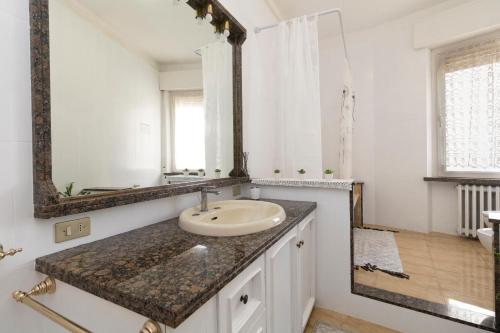 a bathroom with a sink and a mirror at casa a colori in Ancona