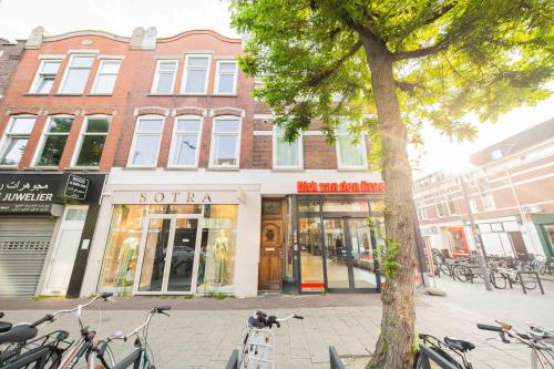 a building on a street with bikes parked in front at Alphabet Apartments - Zwart Janstraat 43 in Rotterdam