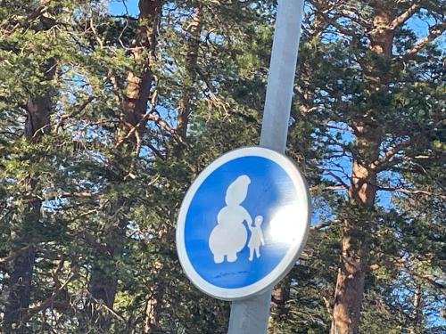 a blue sign with a picture of a bunny and a child at Luxury ski apartment - Lindvallen Sälen 365 Pool & Padel concept in Lindvallen