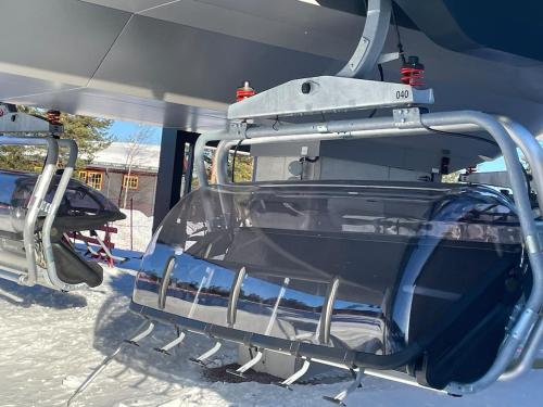 a ski lift with the door open in the snow at Luxury ski apartment - Lindvallen Sälen 365 Pool & Padel concept in Lindvallen