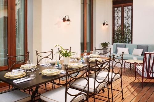 a dining room with a table and chairs at The Hoxton, Florence in Florence