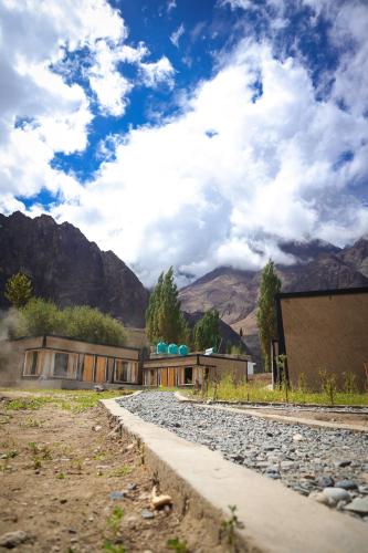 a house on the tracks with mountains in the background at The Khama in Hundar