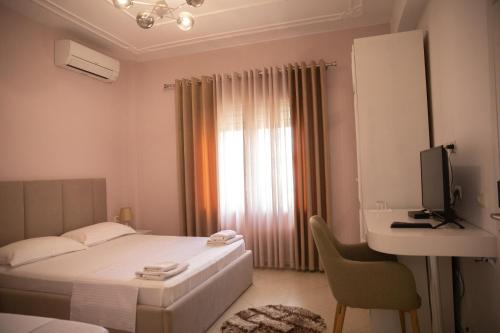Postel nebo postele na pokoji v ubytování Hotel Merkaj