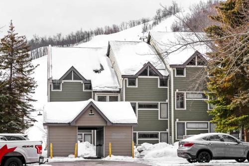 a house with snow on top of it at Blue Mountain Haus - Private Patio - Walk to Blue in Blue Mountains