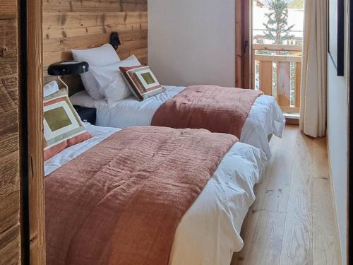 Postel nebo postele na pokoji v ubytování Appartement spacieux aux Gets, 4 chambres, sauna - FR-1-671-286