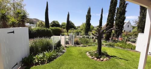a garden with a tree in a yard at The Owl's Nest in McGregor