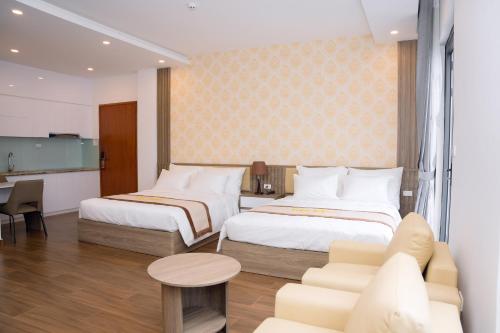 Postel nebo postele na pokoji v ubytování Hải Anh Hotel & Apartment - KDL Đồi Rồng