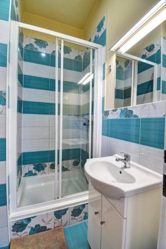 a bathroom with a sink and a shower at Plus Prague in Prague