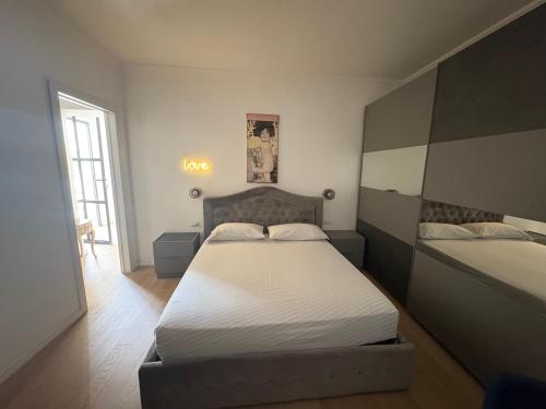 a bedroom with two beds and a window at Casa Mascia Pinna in Maracalagonis