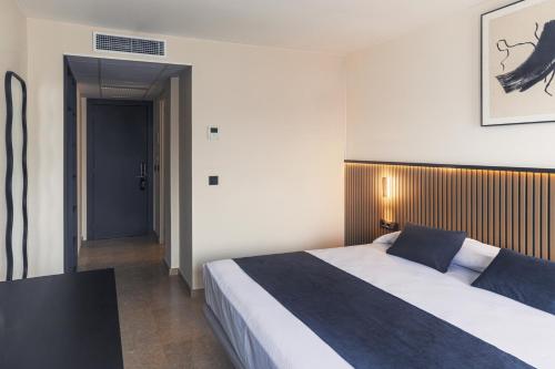 Ένα ή περισσότερα κρεβάτια σε δωμάτιο στο STAR BAY Hotel