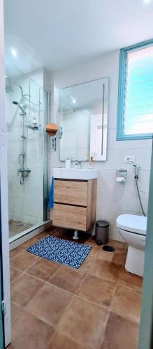 a bathroom with a shower and a sink and a toilet at Joy & Friends 1 in Los Cristianos