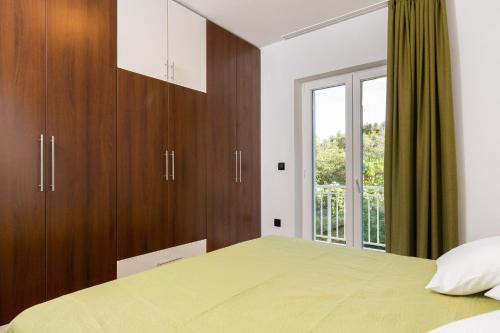 Katil atau katil-katil dalam bilik di Doko Adriatic Residence